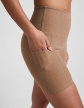 tan high-waisted 5" inseam biker shorts with pockets.